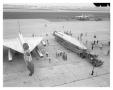 Photograph: [B-58 and Atlas Sitting on a Ramp]