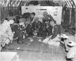 Photograph: XC-99 crew playing cards in flight