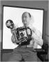 Photograph: L.S. Orrick holding a camera