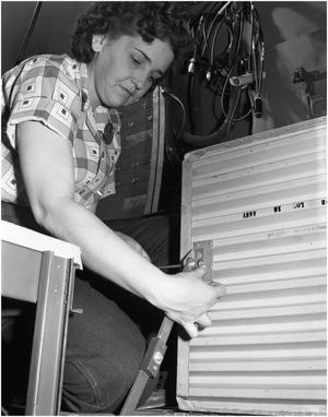 Primary view of object titled 'Myrle Lyons working on B-36 fuselage'.