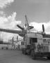 Photograph: Yard and flight and traffic crew hang propeller on engine