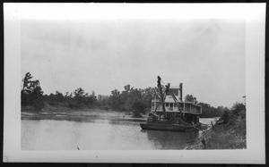 Primary view of object titled '[A Boat Located Close to River Bank. Location Unknown.]'.