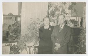 [Annie and John Sharpe Posing with Plants]