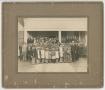Primary view of [Photograph of a Group of People Standing in Front of a Building]