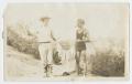 Photograph: [Two Men Holding a Line of Fish]