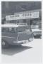 Photograph: [Vehicles Parked in Front of Gordon Drug Store]