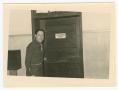 Photograph: [Captain Paul Anderson Standing by Door]