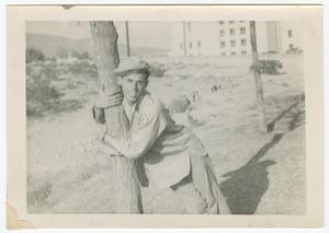 Primary view of object titled '[William Giannopoulos Hugging a Tree]'.
