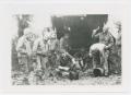 Photograph: [Nine Soldiers by a Lean-To in France]