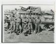 Photograph: [Six Soldiers Posing Against a Tank]