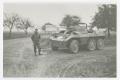 Photograph: [Soldier with Scout Car]
