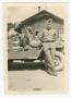 Photograph: [Edwin Lahti Leaning Against a Jeep]