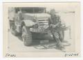 Primary view of [William Giannopoulos Leaning on a Half-Track]