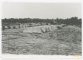 Photograph: [Rows of Tents in an Earthen Field]