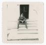 Photograph: [Soldier on Steps of Building]