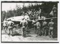 Photograph: [Soldiers Examining a Hidden German Airlane]