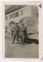 Photograph: [Two Soldiers Standing by a Truck Named "Angela II"]
