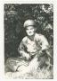Photograph: [Soldier Sitting with a Rifle]
