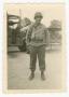 Primary view of [Gabriel Tuchscherer Standing in Front of a Truck]