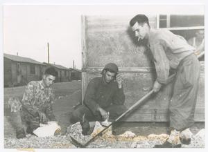 Primary view of object titled '[Soldiers Arranging Rocks in Front of a Hutment]'.