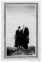 Photograph: [Photograph of Couple Next to Wall]