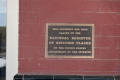 Photograph: [Plaque on Red Brick Building]