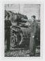 Photograph: [Two Soldiers In Front of Tank]