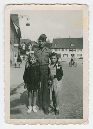 Primary view of [Herbert Schaff with Two Young German Girls]