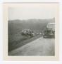 Photograph: [Destroyed Vehicle Beside a Road]