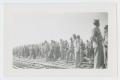 Photograph: [Soldiers Standing by Train Tracks]