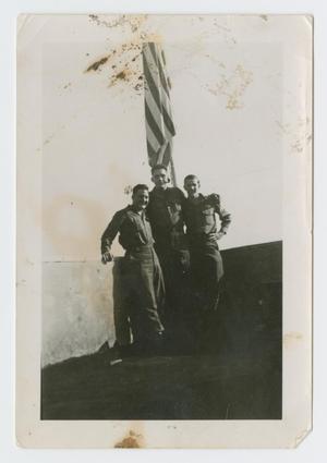 Primary view of object titled '[Three Soldiers by Flag]'.