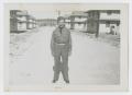 Photograph: [Soldier Standing on Road]