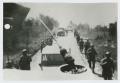 Photograph: [Soldiers Marching Down Road]