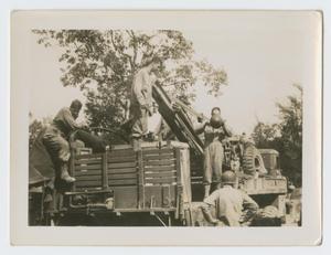 Primary view of object titled '[Soldiers Climbing on Truck]'.