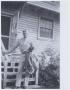 Photograph: [Soldier on Porch Steps]