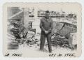 Photograph: [Soldier Amid Wreckage]