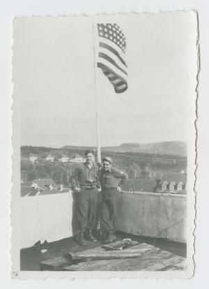 Primary view of object titled '[Two Soldiers by American Flag]'.