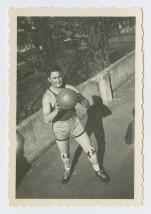 Primary view of object titled '[S/Sgt. Walks with Basketball]'.