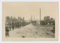 Photograph: [Soldiers Marching Through Town]