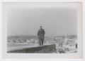 Photograph: [Soldier Standing on Foundation]
