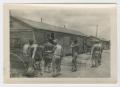Photograph: [Soldiers Outside Hutments]