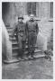 Photograph: [Two Soldiers by Building]