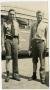 Photograph: Two Men in Front of a Southwestern Bus, Forehead Paint and One Pant L…