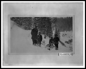 Primary view of object titled 'Four Men with Sled on Mountainside'.