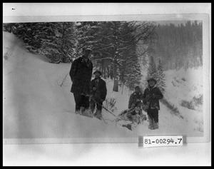 Primary view of object titled 'Four Men With Sled On Mountainside'.