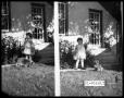 Thumbnail image of item number 1 in: 'Virginia Lee with Puppy by Porch Steps'.