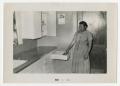 Photograph: [Woman in a Kitchen]