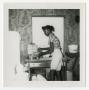 Photograph: [Young Woman Making Waffles]