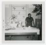 Photograph: [Woman with a Table Display]