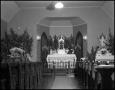Primary view of [Photograph of the Interior of St. Mary's Catholic Church at Christmas]
